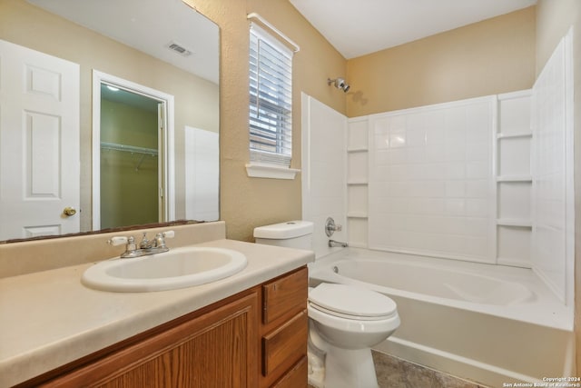 full bathroom featuring tile patterned flooring, shower / washtub combination, vanity, and toilet