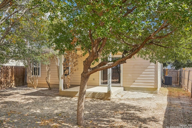 back of property featuring a patio and cooling unit