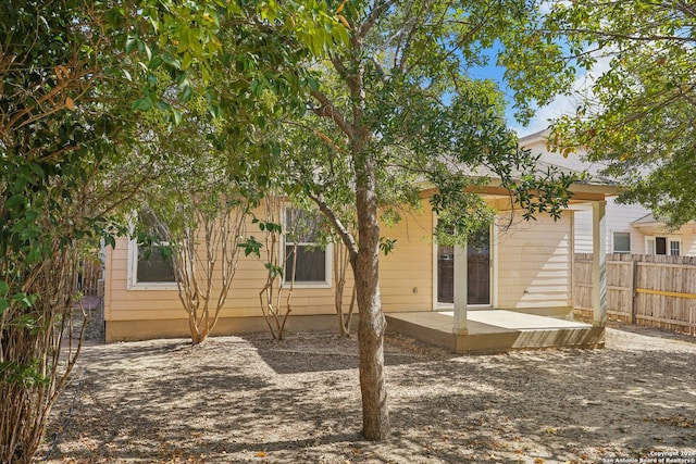 back of property featuring a patio