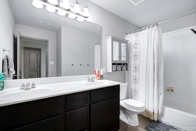 full bathroom with tile patterned floors, vanity, shower / bath combo, and toilet