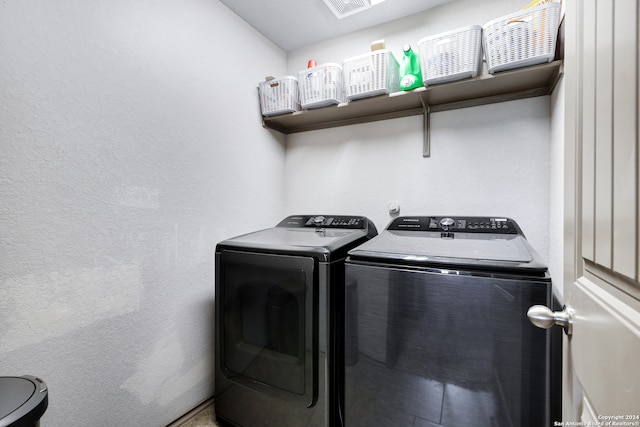 washroom with washer and dryer