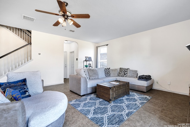 living room featuring tile patterned flooring and ceiling fan