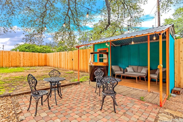 view of patio / terrace featuring an outbuilding