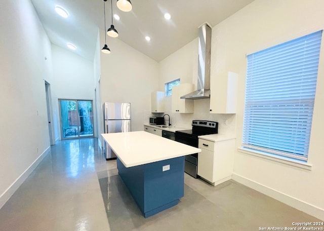 kitchen with wall chimney range hood, electric stove, decorative light fixtures, white cabinets, and a center island