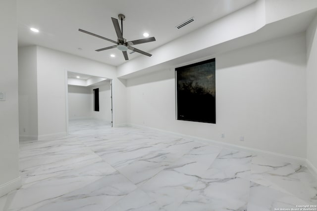 unfurnished room with ceiling fan