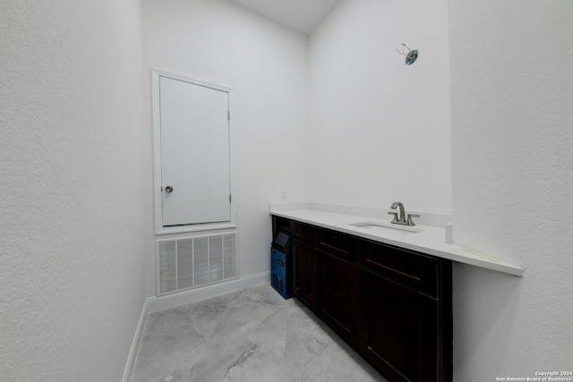 bathroom featuring vanity and concrete floors