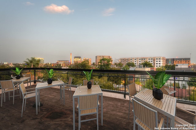 patio terrace at dusk with a balcony