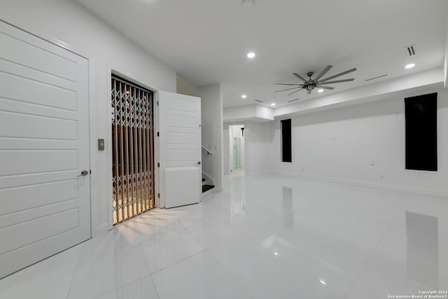 corridor featuring light tile patterned floors