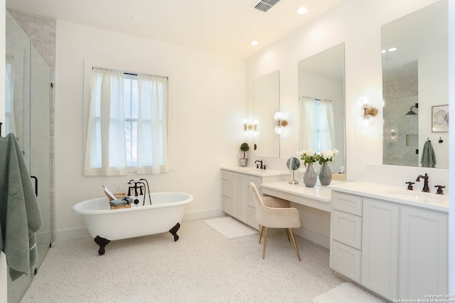 bathroom featuring shower with separate bathtub and vanity