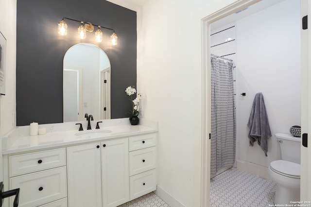 bathroom featuring tile patterned floors, vanity, toilet, and a shower with curtain