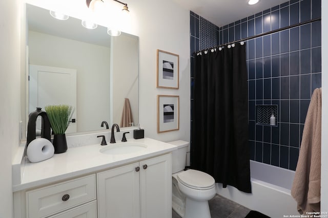 full bathroom featuring tile patterned flooring, vanity, toilet, and shower / bath combo with shower curtain