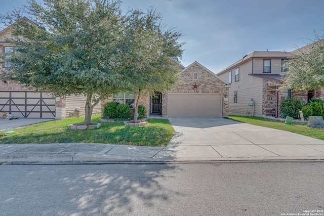 view of front of house featuring a garage and a front yard