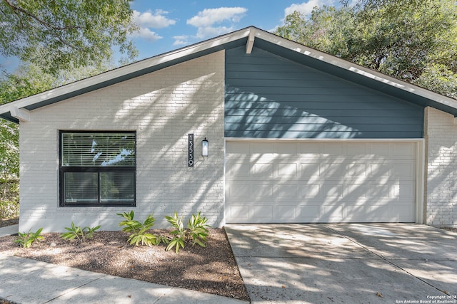 view of property exterior with a garage