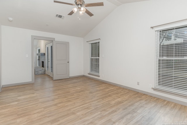 unfurnished room with ceiling fan, high vaulted ceiling, and light hardwood / wood-style flooring