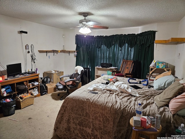 bedroom with a textured ceiling and ceiling fan