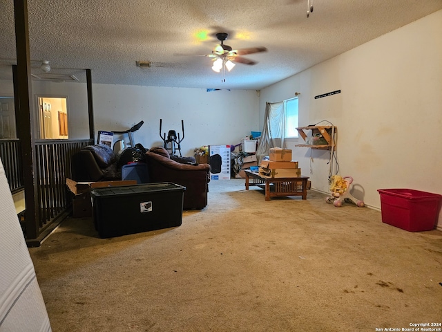 interior space featuring a textured ceiling and carpet floors