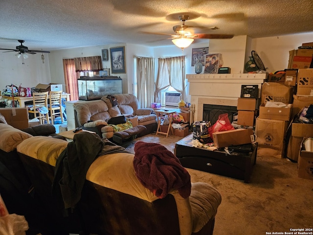 living room with carpet flooring, a healthy amount of sunlight, a textured ceiling, and cooling unit