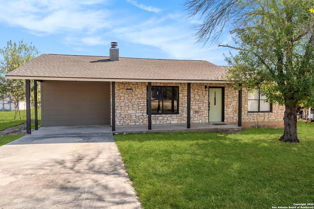 ranch-style home featuring a front yard and covered porch