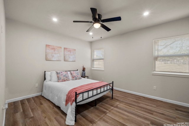 bedroom featuring ceiling fan and hardwood / wood-style flooring