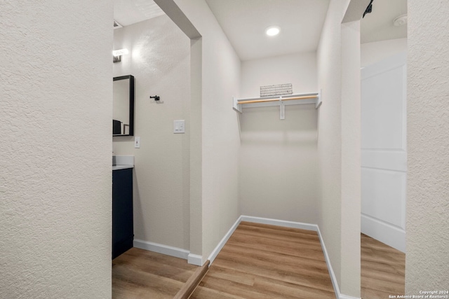 walk in closet featuring hardwood / wood-style floors