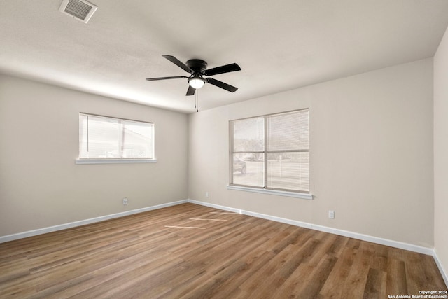 unfurnished room featuring ceiling fan and wood-type flooring