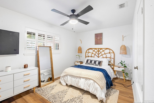 bedroom with ceiling fan and light wood-type flooring