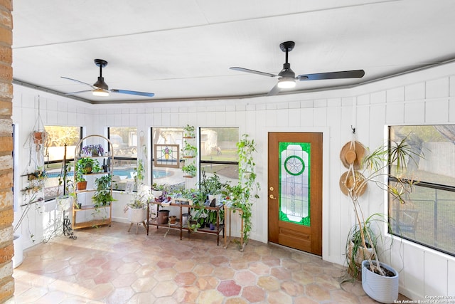 sunroom / solarium with ceiling fan