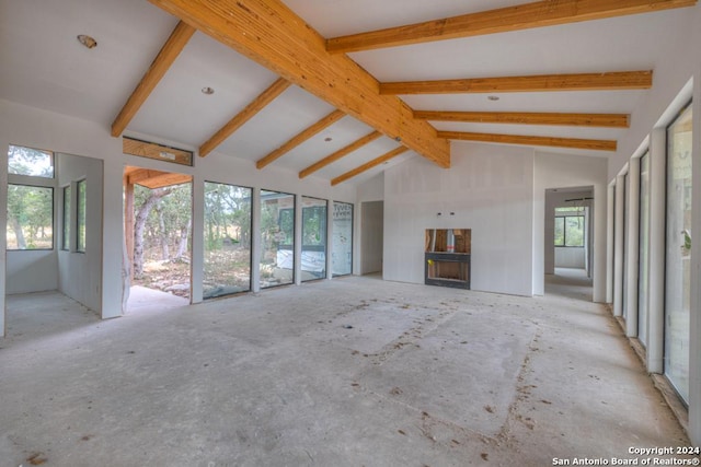 1722 Paradise Pkwy, Canyon Lake, TX 78133 - unfurnished living room with beam ceiling, a fireplace, and high vaulted ceiling