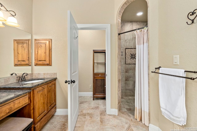 bathroom with vanity and walk in shower