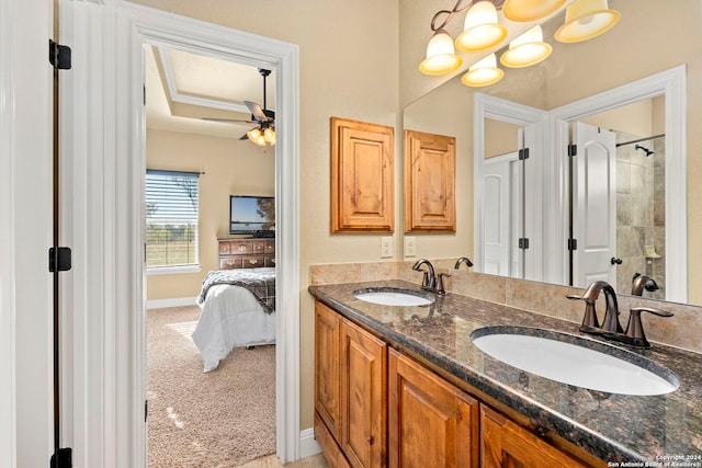 bathroom featuring ceiling fan and vanity