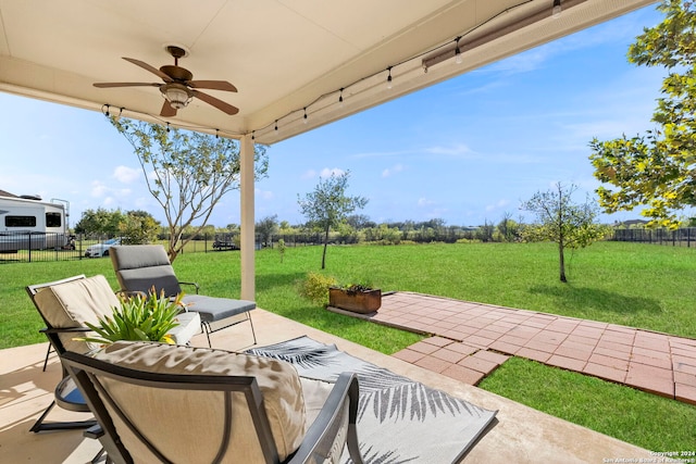 view of patio featuring ceiling fan