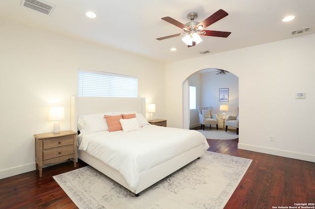 bedroom with ceiling fan and dark hardwood / wood-style floors