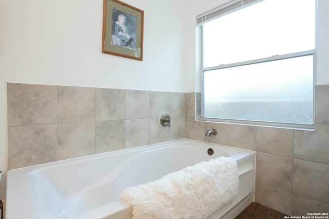 bathroom featuring a tub