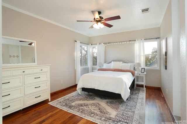 bedroom featuring ceiling fan and dark wood-type flooring