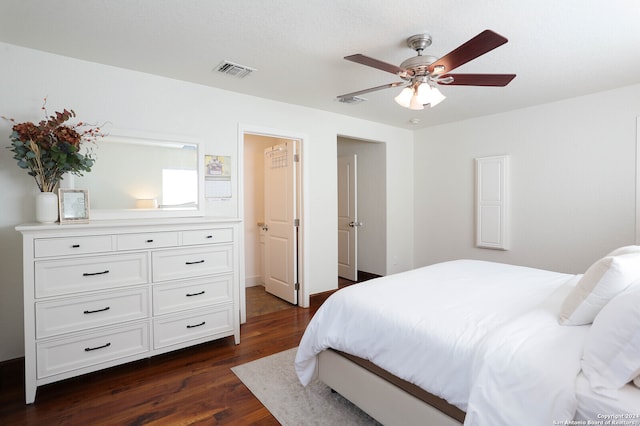 bedroom featuring ceiling fan and dark hardwood / wood-style flooring