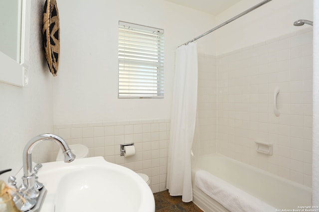 bathroom featuring tile walls, sink, shower / tub combo, and tile patterned flooring