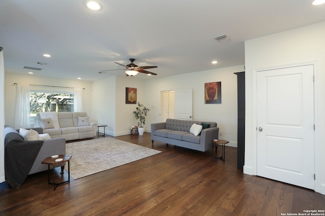 living room with dark hardwood / wood-style floors and ceiling fan