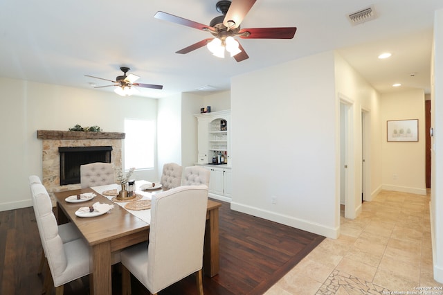 dining area featuring ceiling fan and light wood-type flooring