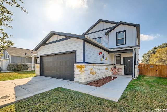 view of front of house with a garage and a front lawn