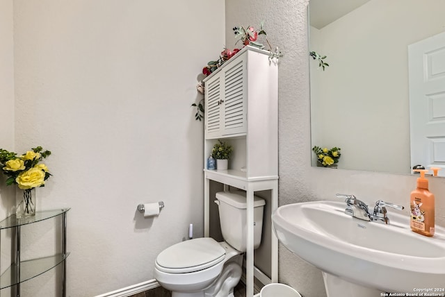 bathroom with toilet and sink