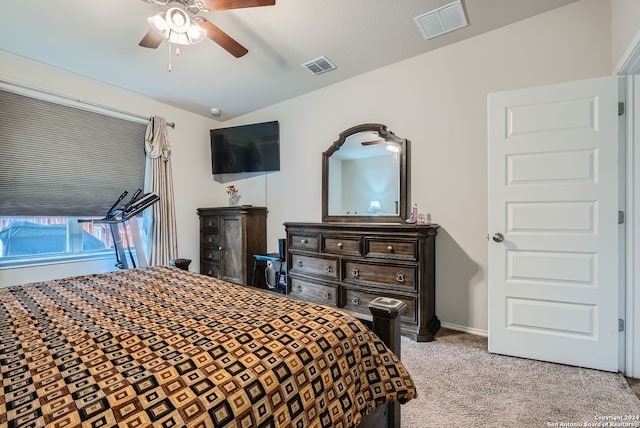 carpeted bedroom featuring ceiling fan and lofted ceiling