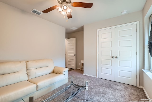 living room with light carpet and ceiling fan