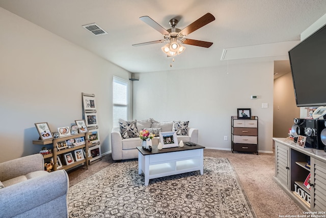 living room with light carpet and ceiling fan