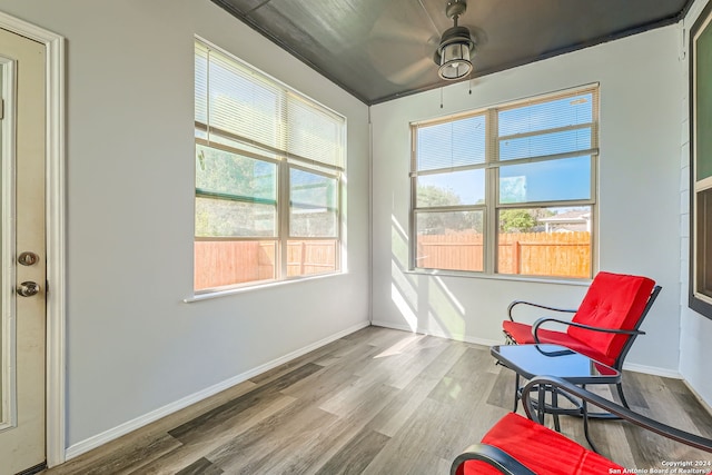 sitting room featuring hardwood / wood-style floors, plenty of natural light, and ceiling fan