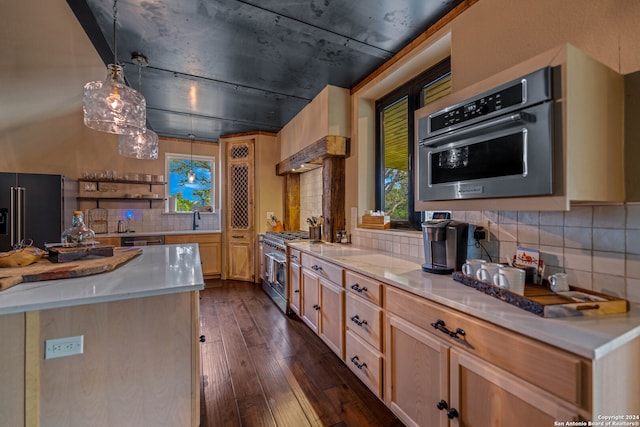 kitchen featuring light brown cabinets, dark wood-type flooring, high quality appliances, decorative light fixtures, and decorative backsplash