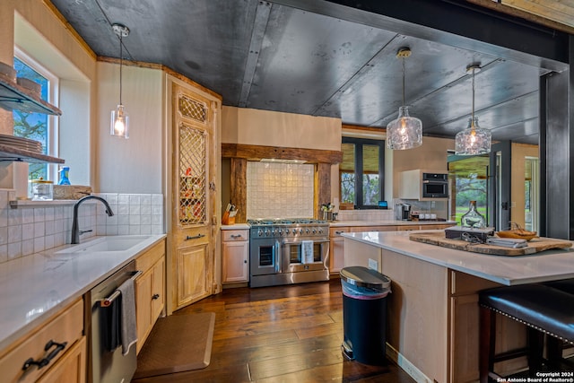 kitchen with decorative light fixtures, backsplash, stainless steel appliances, and dark wood-type flooring