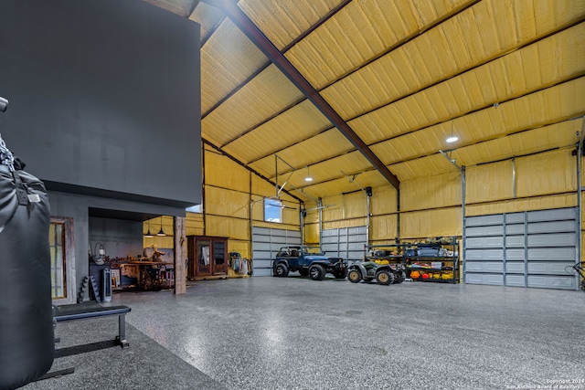 garage featuring wood ceiling and a carport