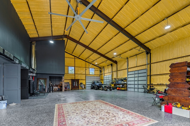 garage featuring ceiling fan and wood ceiling