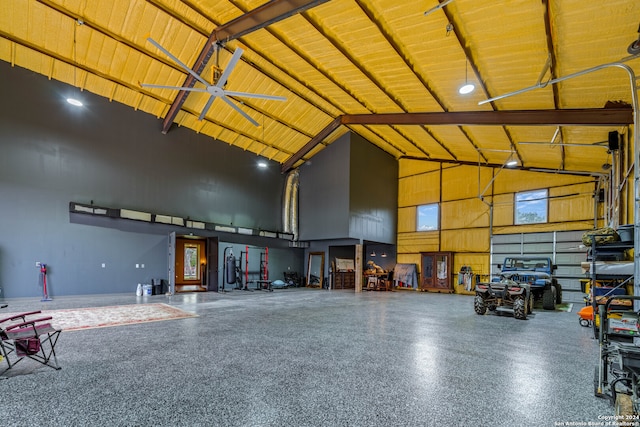 garage with a carport, ceiling fan, and wooden ceiling