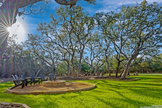 view of yard with a fire pit